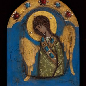 May include: A painting of an angel with brown hair and a green robe. The angel has gold wings and is surrounded by a gold halo. The background is blue with gold accents.