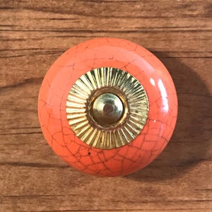 Pumpkin orange ceramic furniture cabinet knob crackle design gold steel hardware.