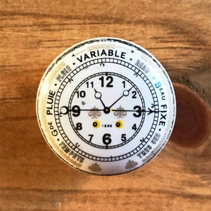 White ceramic clock face decal furniture / cabinet knob with black lettering and yellow detail