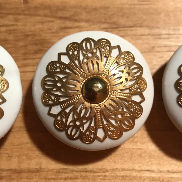 White ceramic furniture / cabinet knob with gold brass metal stamped detail