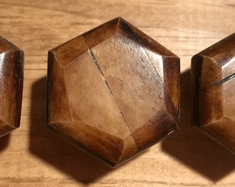 Brown and black wooden natural knob with knot and wood grain feature silver steel hardware