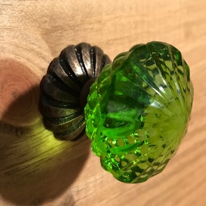 Green “depression era” glass rose bud shape brass stem with brass scalloped style circular base