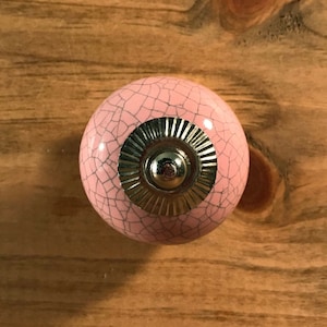 Powder pink ceramic furniture cabinet knob crackle paint silver steel hardware.