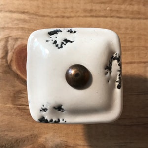 Creamy White ceramic square furniture / cabinet knob + distressed appearance black speckles + brass stem