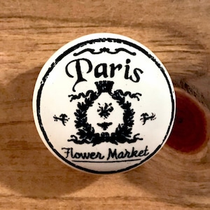 White ceramic word art decal furniture / cabinet knob with black lettering Paris flower market