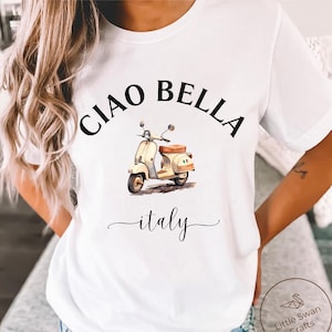 May include: White t-shirt with a black graphic of a scooter and the text 'Ciao Bella Italy'.