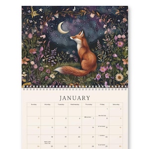 May include: A wall calendar for January featuring a fox sitting in a field of colorful wildflowers under a crescent moon and starry night sky. The calendar grid includes days of the week, dates, and lunar phases printed in black on a cream background.