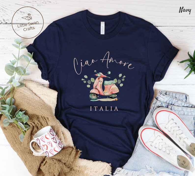 May include: Navy blue t-shirt with a pink scooter graphic and the text "Ciao Amore ITALIA".