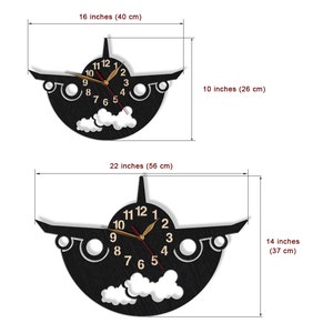 May include: Black wooden aeroplane clock with gold hands and white clouds. The clock measures 16 inches by 10 inches or 22 inches by 14 inches.