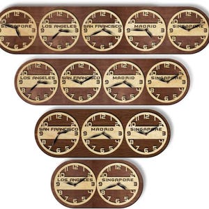 May include: A collection of wooden world clocks, each displaying a different time zone. The clocks are round with a light-colored face and dark hands, set against a dark brown wooden base. The time zones include Singapore, Los Angeles, San Francisco, and Madrid.