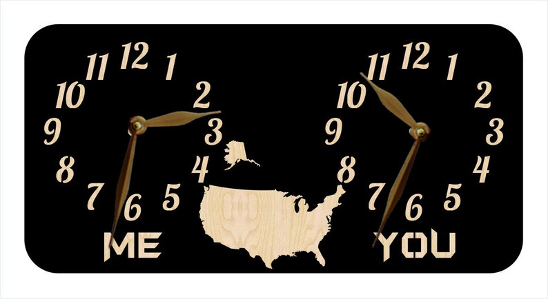 May include: A black wooden clock with two clock faces, each with a map of the United States in the centre. The clock faces are labelled "ME" and "YOU".