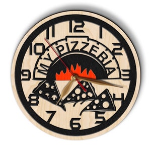 May include: A wooden clock with black numbers and a pizza oven design. The clock face says "My Pizzeria" with a red and orange flame inside the oven. The clock hands are black and red.