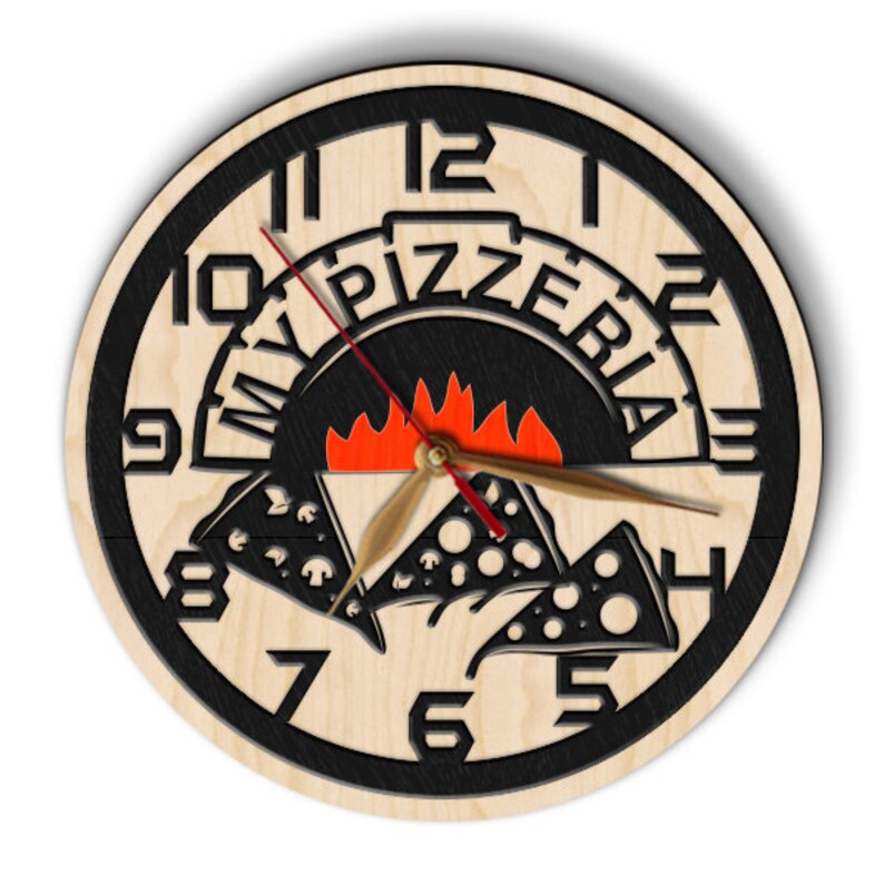 May include: A wooden clock with black numbers and a pizza oven design. The clock face says "My Pizzeria" with a red and orange flame inside the oven. The clock hands are black and red.