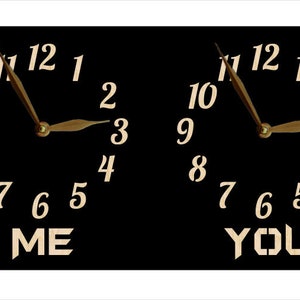 May include: Two black clocks with white numbers and gold hands. The clocks are side by side and the words "ME" and "YOU" are written below them.