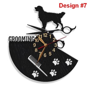 May include: Black and white clock with a dog silhouette, scissors, comb, and paw prints. The clock face says "Grooming" and has gold numbers.