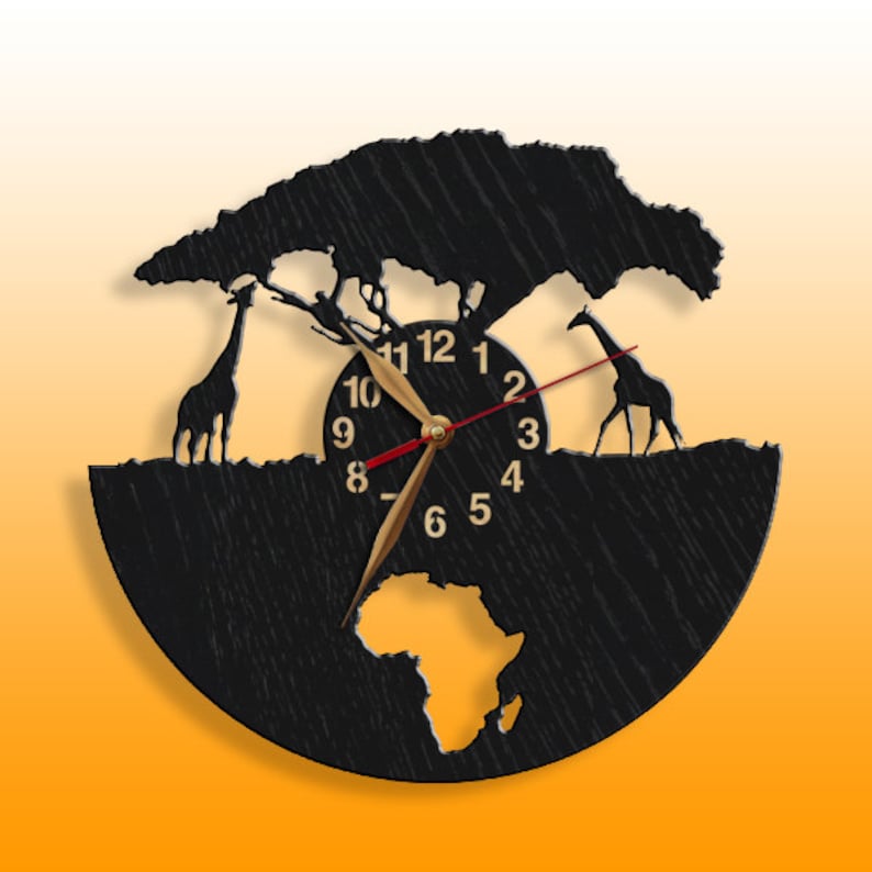 May include: Black wooden clock with a silhouette of an acacia tree, two giraffes, and the continent of Africa. The clock face has gold numbers and hands, and a red second hand. The clock is set against a gradient orange background.