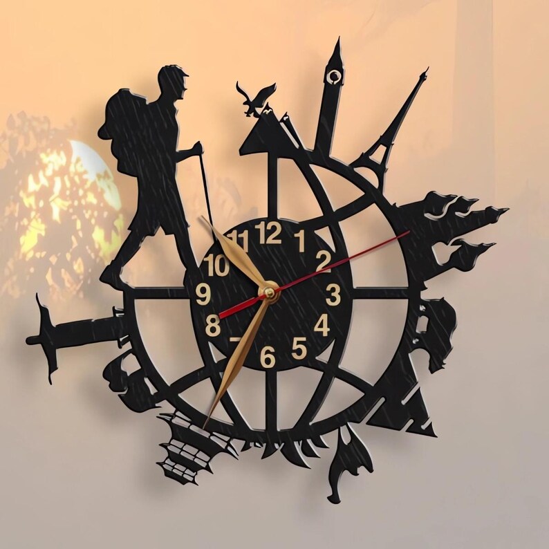 May include: Black clock with gold hands and Roman numeral markings. The clock is surrounded by silhouettes of landmarks from around the world, including the Eiffel Tower, the Statue of Liberty, and the Great Wall of China.