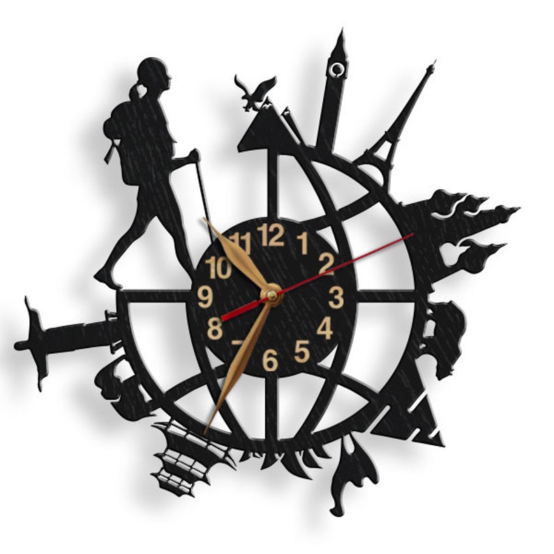 May include: Black clock with a silhouette of a traveler and landmarks around the world. The clock face has gold numbers and hands.
