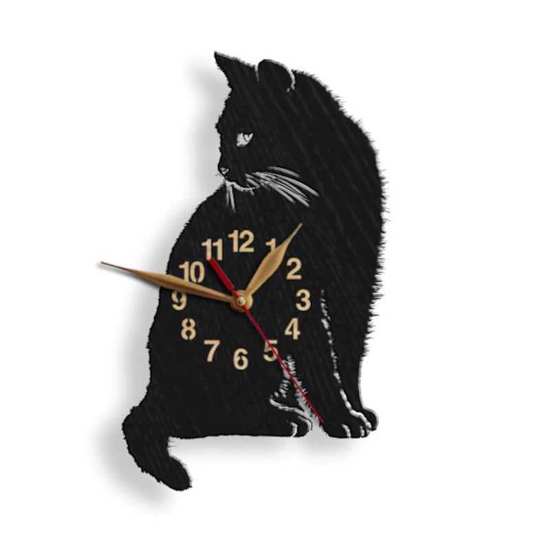 May include: Black cat silhouette wall clock with gold-colored hands and numbers. The clock is made of wood and has a rustic look.