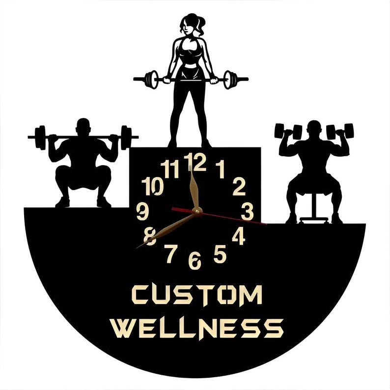 May include: Black and white silhouette of a clock with a custom wellness design. The clock face features a black background with white numbers and gold hands. The clock is surrounded by three silhouettes of people lifting weights.