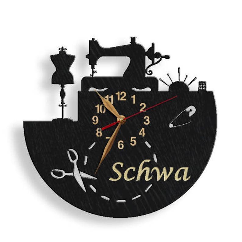 May include: Black wooden clock with a sewing machine, a dress form, and a pair of scissors. The clock face has gold numbers and hands, and the word "Schwa" is written in gold lettering below the clock face.