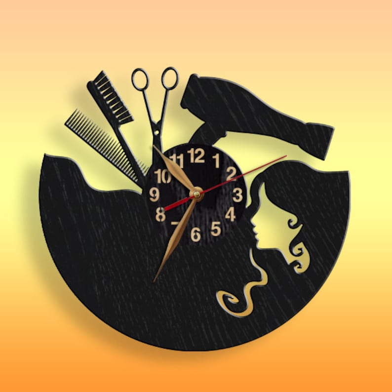 May include: Black wooden clock with a silhouette of a woman's face and hair, a hairdryer, scissors, and combs. The clock face has gold numbers and hands.