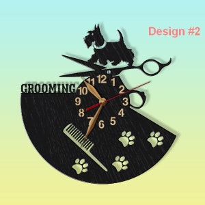 May include: Black wooden clock with a grooming theme. The clock face features a silhouette of a dog, scissors, a comb, and paw prints. The clock face reads "Grooming" and has the numbers 1 through 12.