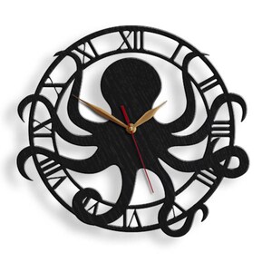May include: A black octopus wall clock with Roman numerals. The clock has a detailed octopus design in the centre, with gold-coloured clock hands and a red second hand. The clock is round and has a dark wood grain texture.