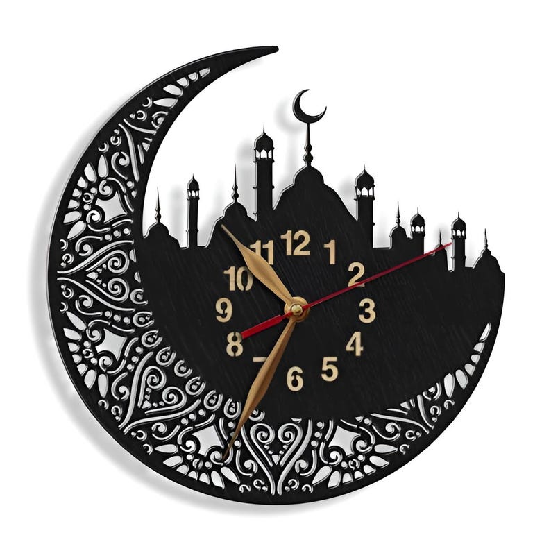 May include: Black wooden wall clock with a crescent moon design and a mosque silhouette. The clock face has gold Arabic numerals and a red and gold hour and minute hand.