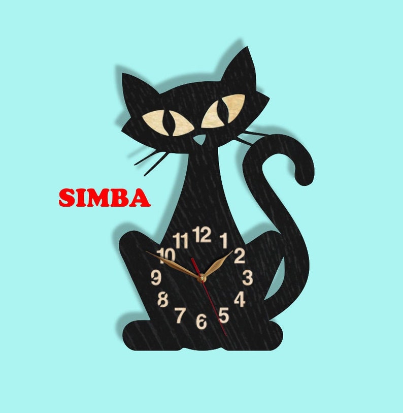 May include: Black cat-shaped wall clock with a gold clock face and black numbers. The clock has a red second hand and a gold minute hand. The clock is labeled "SIMBA" in red letters.