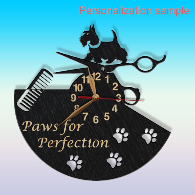 May include: Black wooden clock with a silhouette of a dog, scissors, and a comb. The clock face has gold hands and Roman numerals. The text "Paws for Perfection" is written below the clock face.