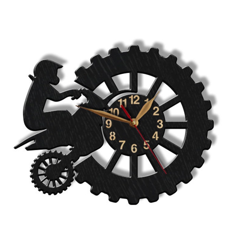 May include: Black silhouette of a person riding an ATV, with a clock face in the background. The clock face has gold numbers and hands, and a red second hand.