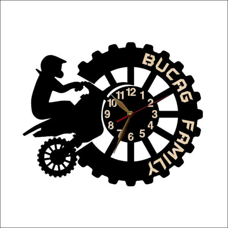 May include: Black and white wall clock with a silhouette of a motocross rider and the words "Bucag Family" around the clock face.