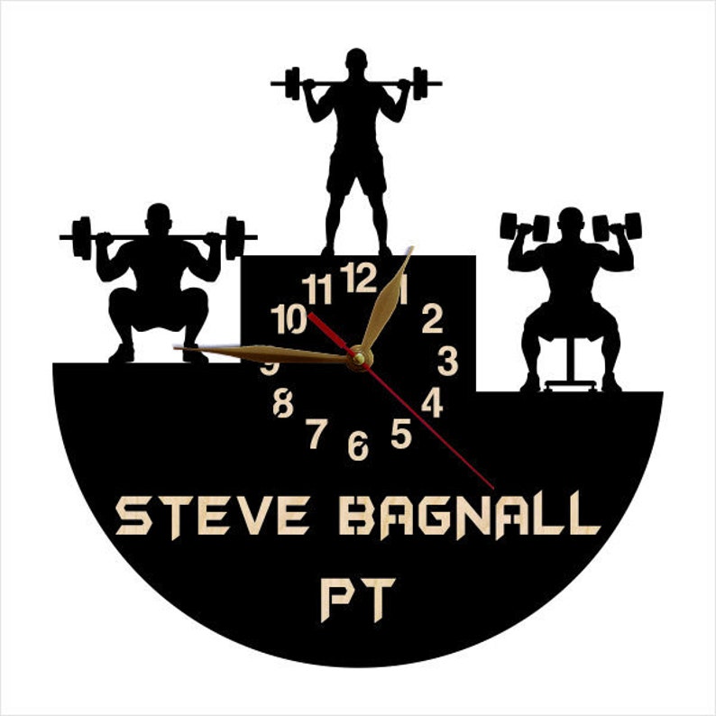 May include: Black and white clock with a silhouette of a person lifting weights. The clock face has a black background with white numbers and hands. The clock is labeled "STEVE BAGNALL PT".