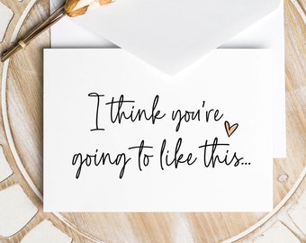 May include: A white card with the text "I think you're going to like this..." written in black cursive with a small pink heart.