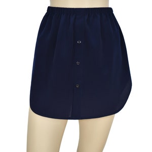 May include: A navy blue skirt with a button-up front and an elastic waistband.