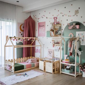 Cozy girl's room featuring a low-height clothes stand for effortless outfit pickup