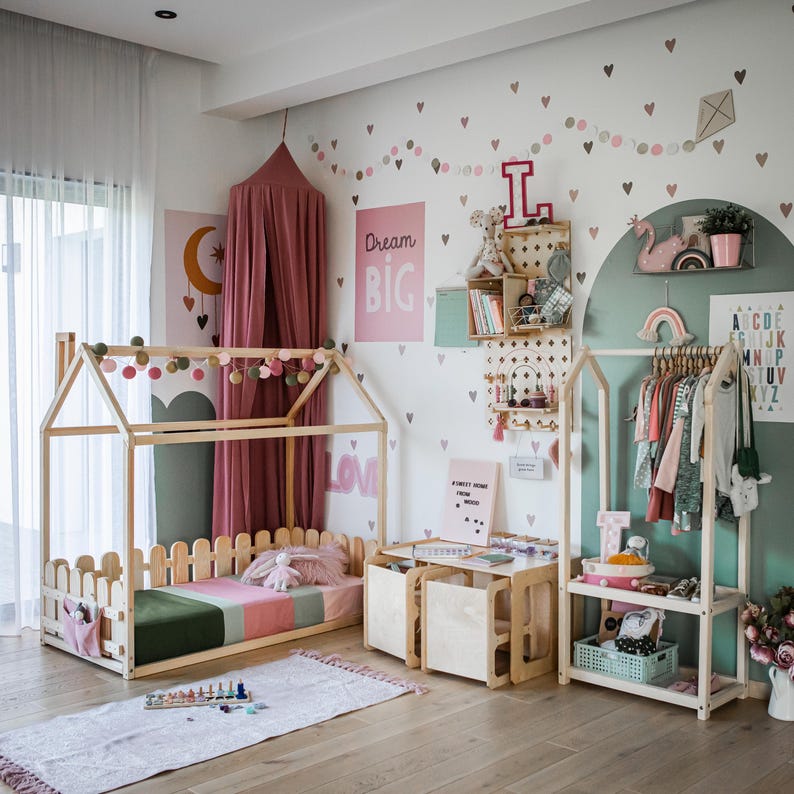 Cozy girl's room featuring a low-height clothes stand for effortless outfit pickup