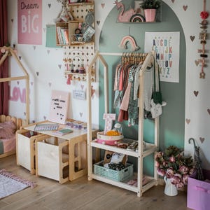 Sweet Home from Wood dress-up station keeping play outfits organized and accessible