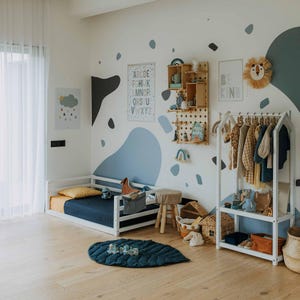Spacious Montessori bedroom layout featuring an easy-access child garment rail