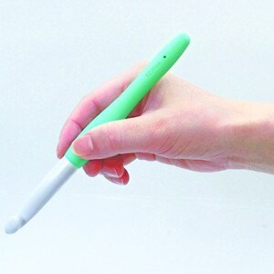 May include: A green and white crochet hook with a soft, rubberised grip.