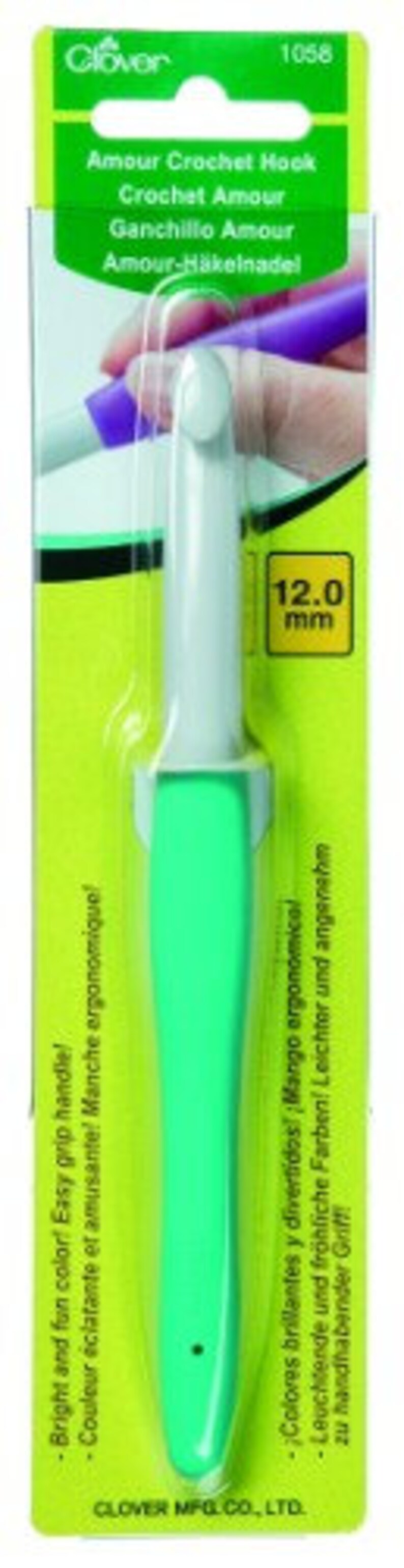 May include: A green and white Clover Amour crochet hook with a 12.0 mm size label. The hook has an ergonomic handle and is packaged in a green and white plastic sleeve.