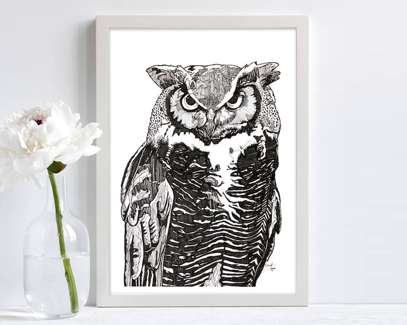 May include: Black and white line drawing of an owl with a fierce expression. The owl is facing forward with its wings folded. The drawing is detailed and intricate.
