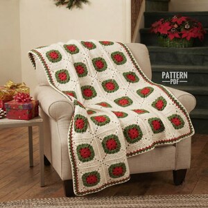 May include: A crochet blanket featuring a repeating granny square pattern in cream, forest green, and bright red. The blanket is draped over a beige armchair. The text "PATTERN PDF" is visible in the upper right corner of the image.