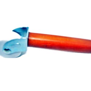 May include: A blue and white pizza cutter with a red wooden handle. The cutter has a round blade and a handle with a grip.