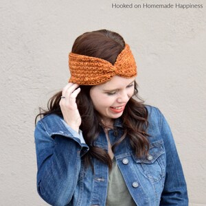 May include: A woman wearing a brown crocheted headband with a knot on top. She is wearing a blue denim jacket and a green t-shirt.