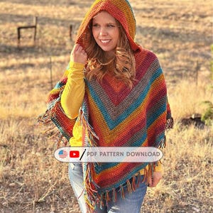 May include: A vibrant, hooded crochet poncho with fringing. The poncho displays a striped pattern in shades of red, orange, yellow, teal, and grey. The text "PDF PATTERN DOWNLOAD" is visible.