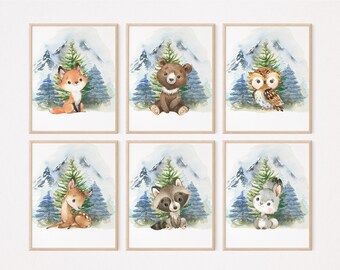 May include: Set of six watercolor illustrations featuring woodland animals in a snowy mountain setting. The animals include a fox, bear, owl, deer, raccoon, and rabbit. Each illustration is framed with a light brown frame.