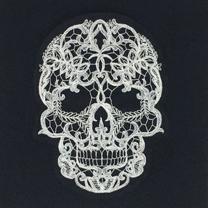 May include: White lace skull design on a black background. The skull is intricately detailed with floral patterns.