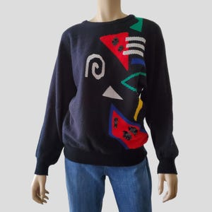 Suéter vintage de los años 80 con bloques de color, manga dolman, lentejuelas de lúrex y intarsia en colores primarios